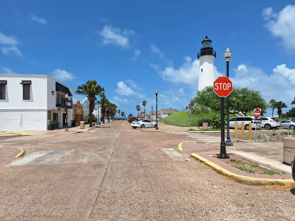 Decorative pole cover in front of lighthouse