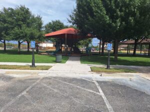 Two Pole Covers in front of an HOA playground