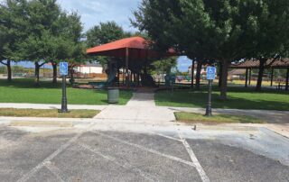 Two Pole Covers in front of an HOA playground