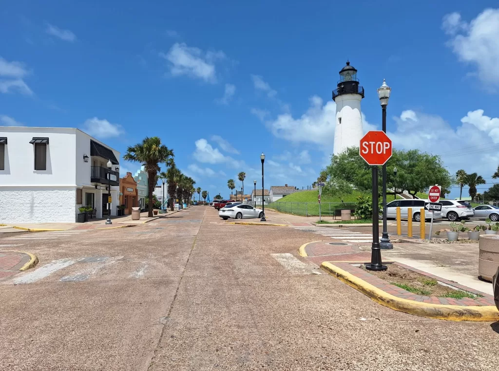 Decorative pole cover in front of lighthouse